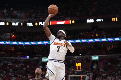 Sources: Nuggets PG Reggie Jackson picking up $5.25M option.